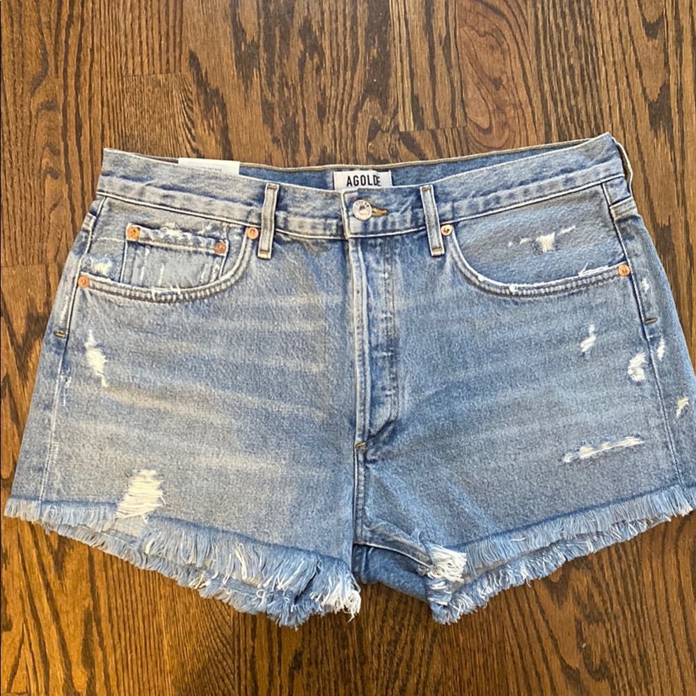 Agolde Blue Jean Shorts with High-Waisted Cut and Distressed Hem